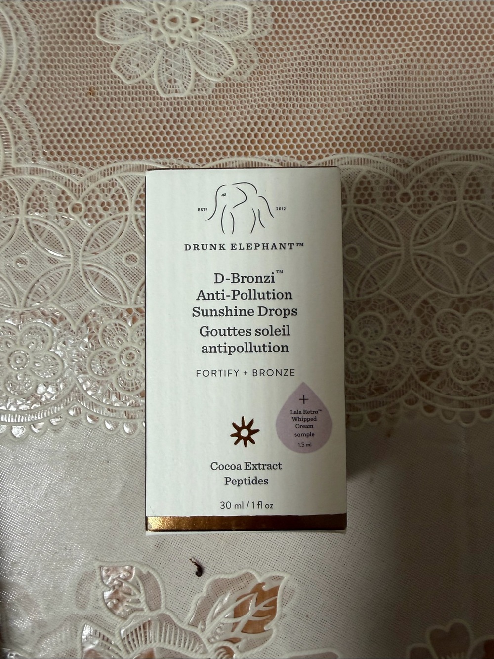 Drunk Elephant D-Bronzi Anti-Pollution Sunshine Drops — White with Gold Accent